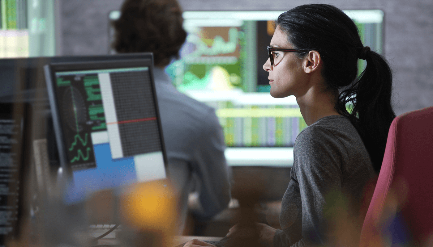 Business Intelligence engineer looking at computer screen at InCentrik