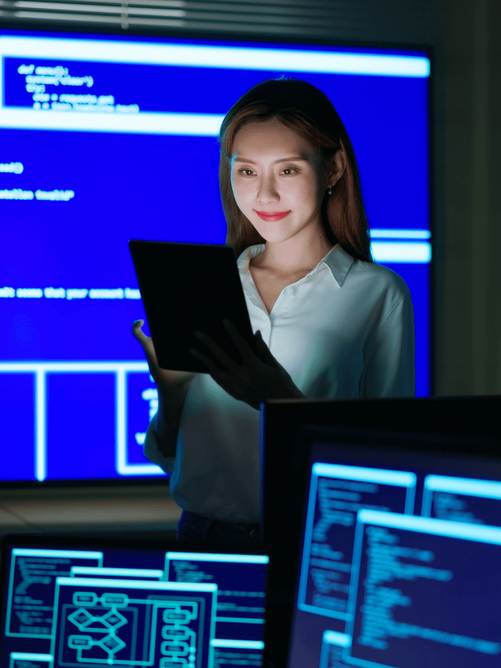 A worker using an ipad to look at data and analytics.