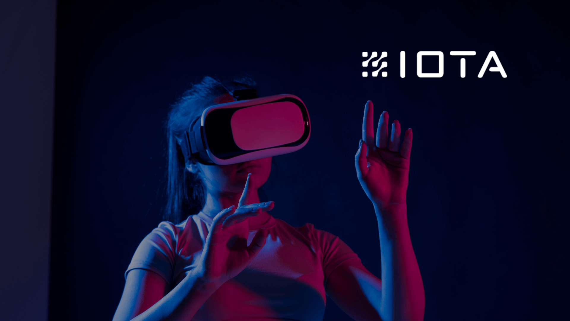 A worker in a dark room using IOTA XR on a VR headset (1)