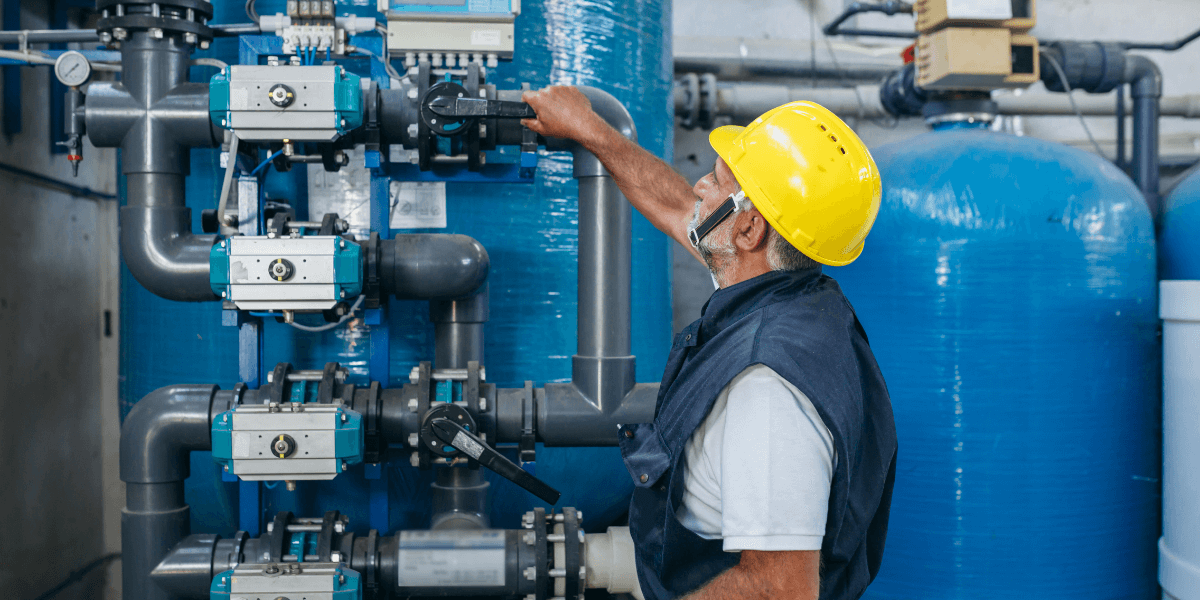 Worker inspecting valve